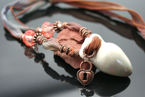 amphora aromatherapy necklace on silk ribbon with beads and charms