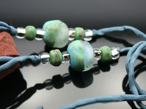 organic lampwork beads on silk cord