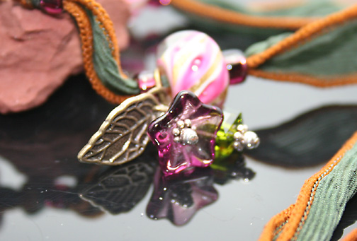 close-up of charms and beads