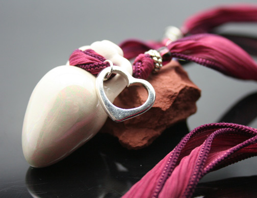 aromatherapy jewelry with mini amphora, silk ribbon, crystals, and sterling silver charms