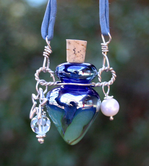 aromatherapy jewelry with mini-perfume bottle and charms