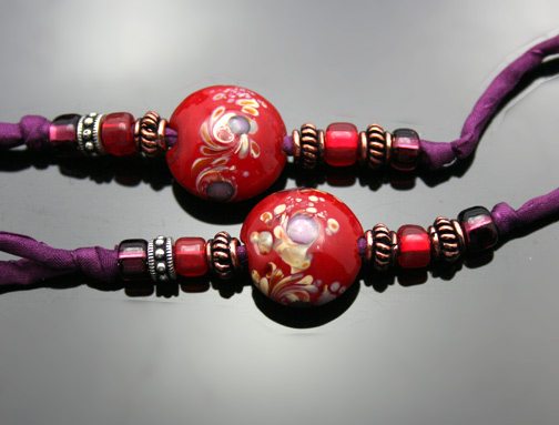 close-up photo of the red glass beads