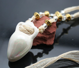 celestial aromatherapy necklace with gold tone beads