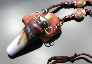 pink and brown glass bottle aromatherapy necklace with beads and silk cord