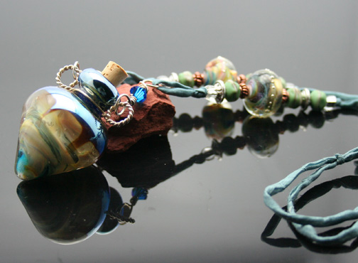 aromatherapy necklace with silk cord, crystals, silver wire, and lampwork beads