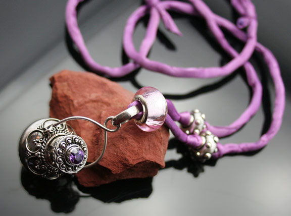 Sterling silver aromatherapy necklace on a purple silk cord with glass beads