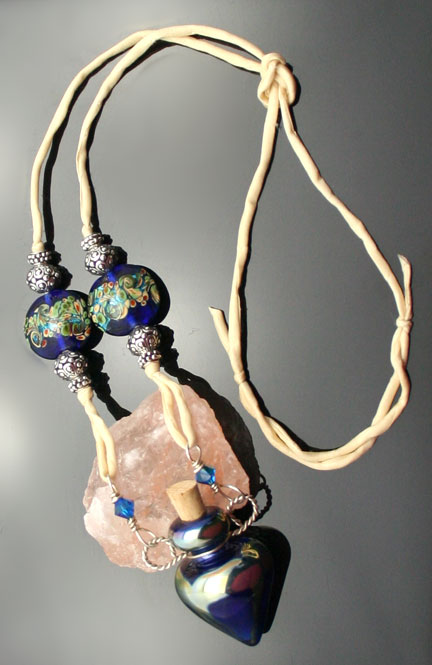 beautiful glass aroma necklace with sterling silver and glass beads on a silk cord