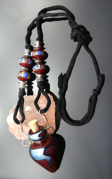 aromatherapy jewelry: a gorgeous glass bottle pendant, silk cord, and very cool beads on this awesome necklace!