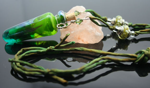 a close-up photo of this gorgeous piece of vibrabt green aromatherapy jewelry
