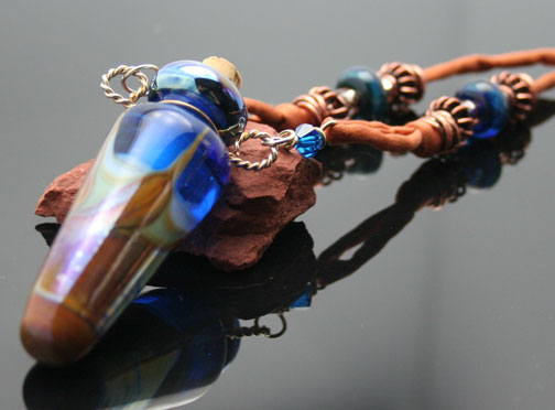 Opalescent swirls of sky blue and Sedona red earth-tones describes this delightful aromatherapy necklace