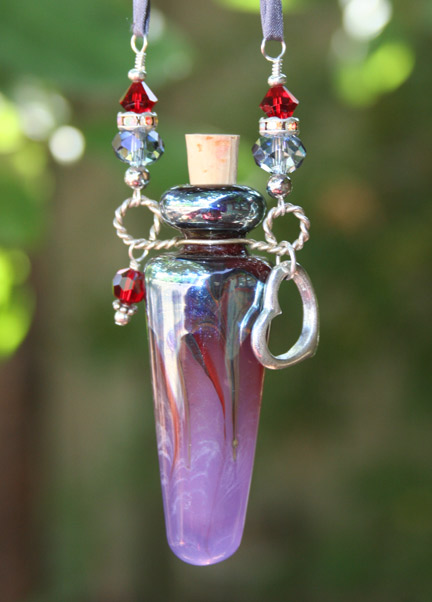 Glass aromatherapy jewelry with silk cord and silver beads
