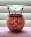 Photo of our gorgeous Asian-Inspired red leaf aroma lamp that uses a tealight candle