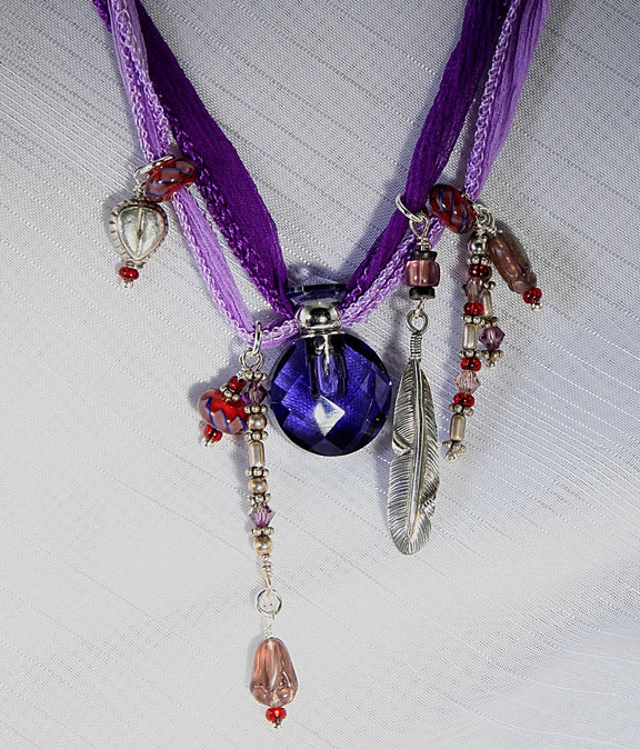 Beautiful aromatherapy jewelry on gauzy silk ribbon with sterling silver and red glass beads - very fun!