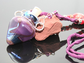purple glass bottle necklace with silk and beads