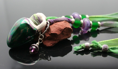 Aromatherapy jewelry featuring ceramic amphoras, silk cord or ribbon, and beautiful beads