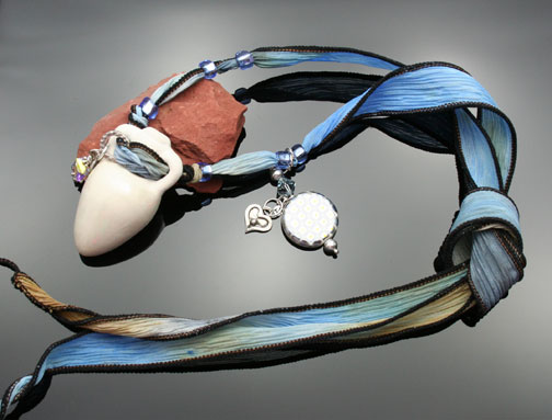 photo of blue watercolor ribbon and pendant