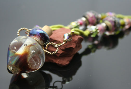 One-of-a-kind aromatherapy necklaces with silk cords and sterling silver beads