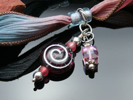 Photo of crystal dangles with silver findings and a Czech glass spiral bead